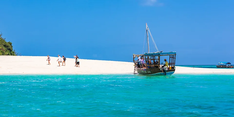 Guests relaxing on Diani Beach after a Kenya safari
